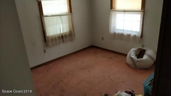 520 Atz Road Malabar, FL 32950 - Photo 13 of 15 a view of an empty room with a window
