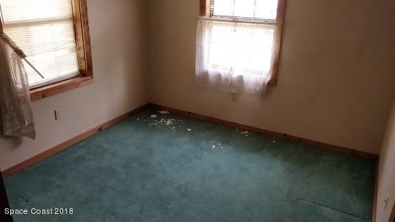 520 Atz Road Malabar, FL 32950 - Photo 14 of 15 a view of an empty room with a window