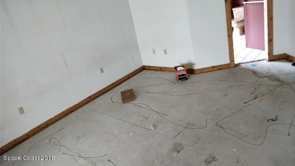 520 Atz Road Malabar, FL 32950 - Photo 9 of 15 a view of a room with rack and stairs