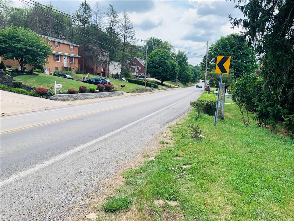 1138 Logan Road Bethel Park, PA 15102 - Photo 6 of 15 a street sign on the side of the road