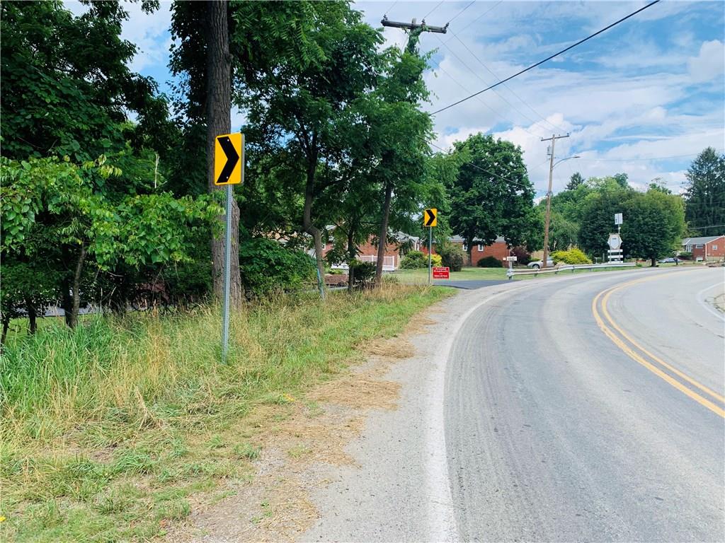 1138 Logan Road Bethel Park, PA 15102 - Photo 8 of 15 a front view of a house with a yard and tree