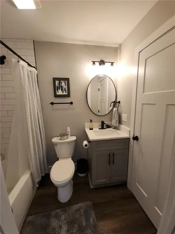 a view of house with wooden stairs and a fence