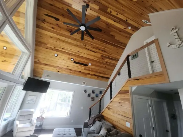 a bedroom with a bed and a chair