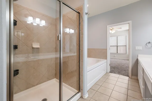 a bathroom with a bathtub and a shower