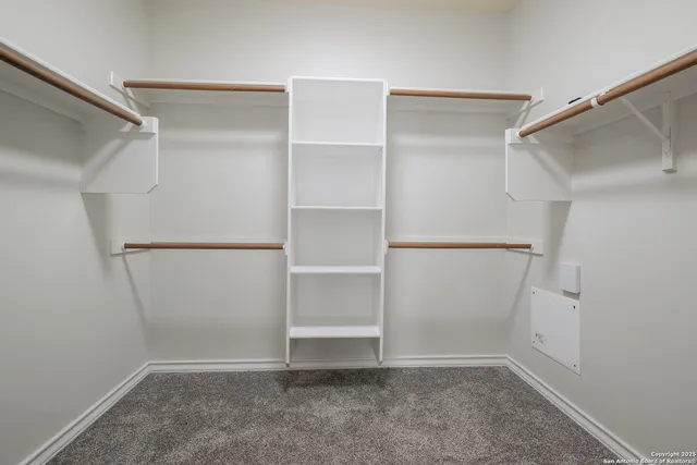 a view of an empty walk in closet