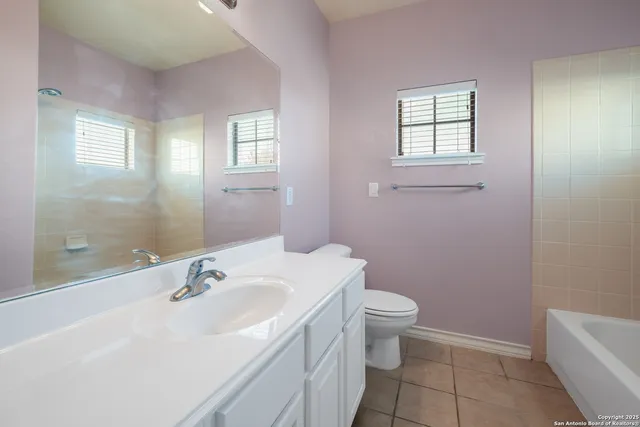 a bathroom with a sink toilet and vanity