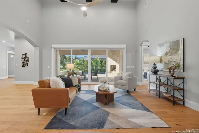 a living room with furniture and a large window