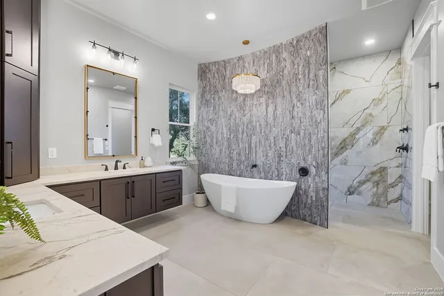 a large tub sitting in a bathroom