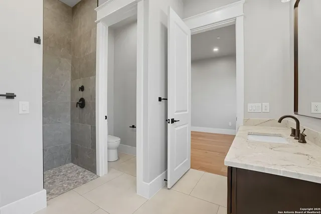 a bathroom with a sink and a toilet