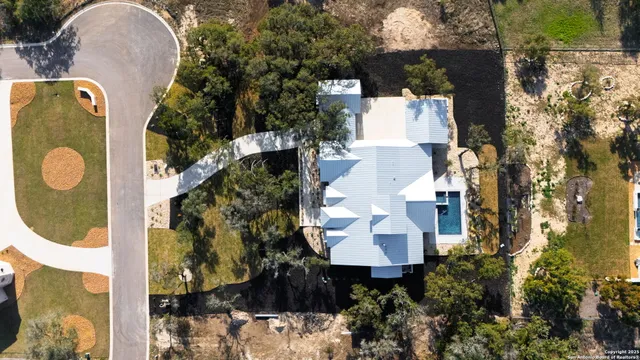 an aerial view of a house with a garden