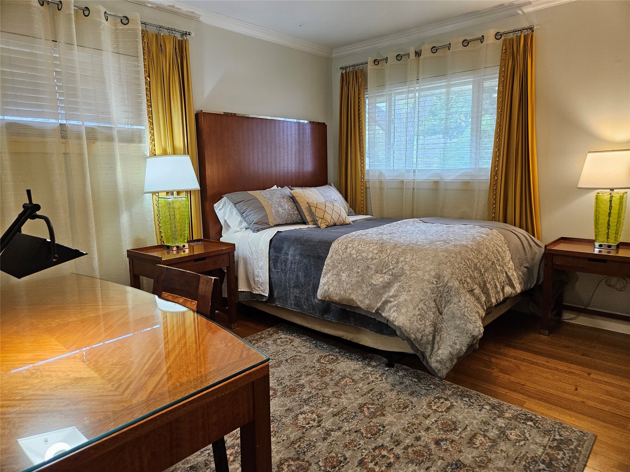 5203 Chesapeake Way Houston, TX 77056 - Photo 15 of 28 a bedroom with a bed and wooden floor