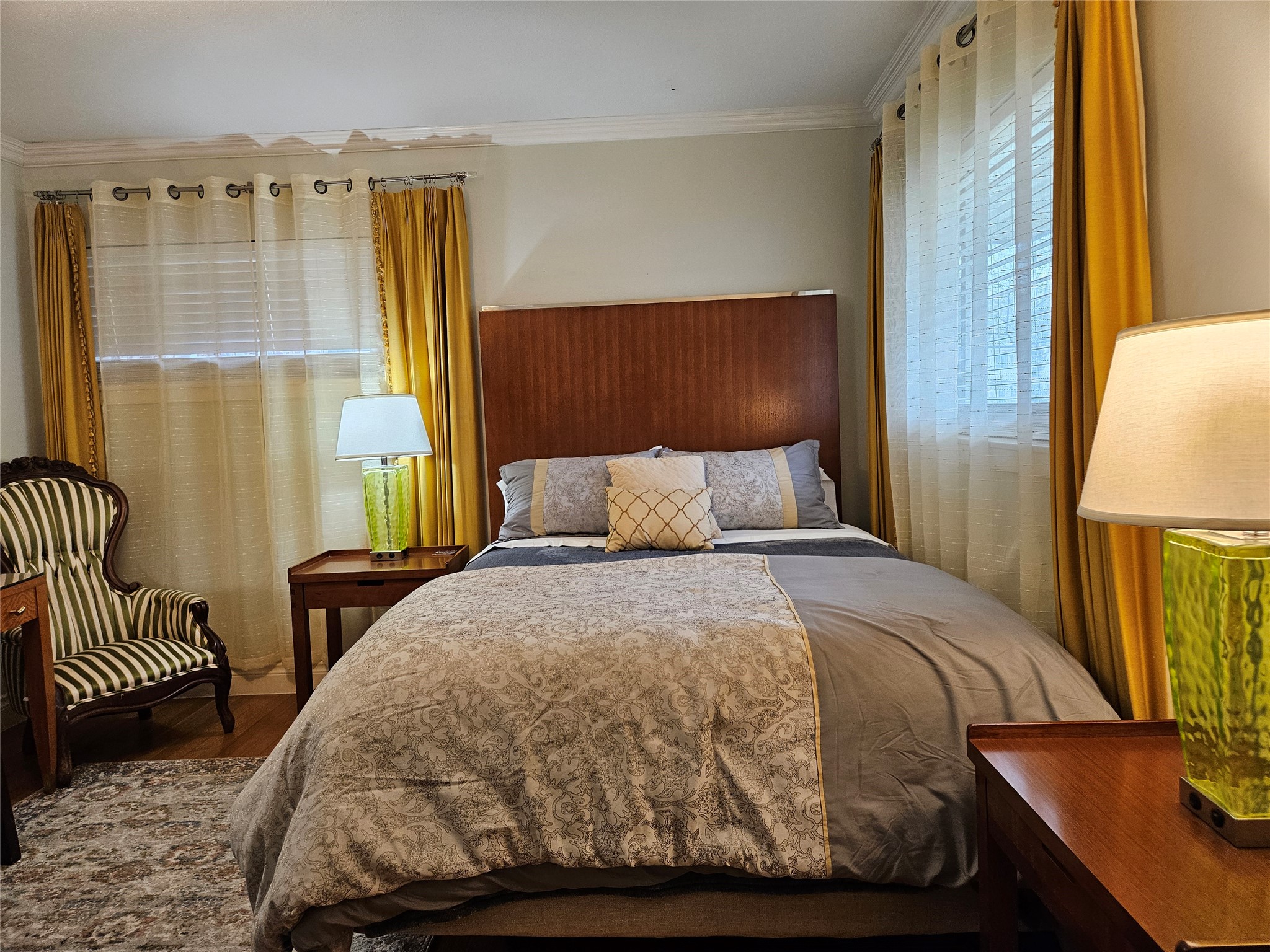 5203 Chesapeake Way Houston, TX 77056 - Photo 16 of 28 a bedroom with a bed and wooden floor