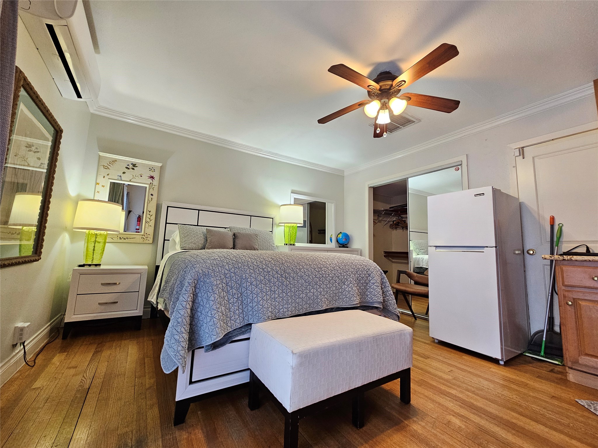 5203 Chesapeake Way Houston, TX 77056 - Photo 22 of 28 a bedroom with a bed and wooden floor