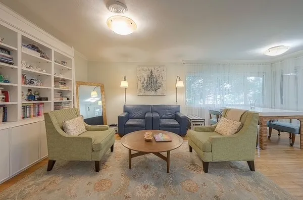 a living room with furniture and a rug