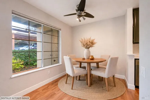 a view of a dining room with furniture window and wooden floor