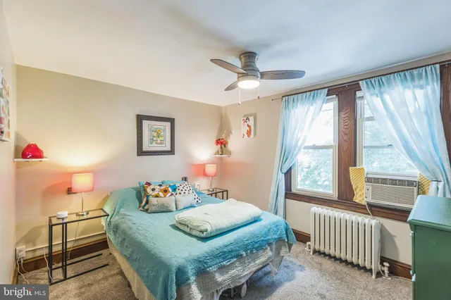 a bedroom with a bed and a table