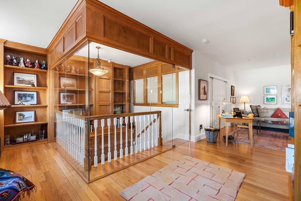 391 Walnut Street, Unit 4 Newton, MA 02460 - Photo 11 of 26 a view of a living room and workspace