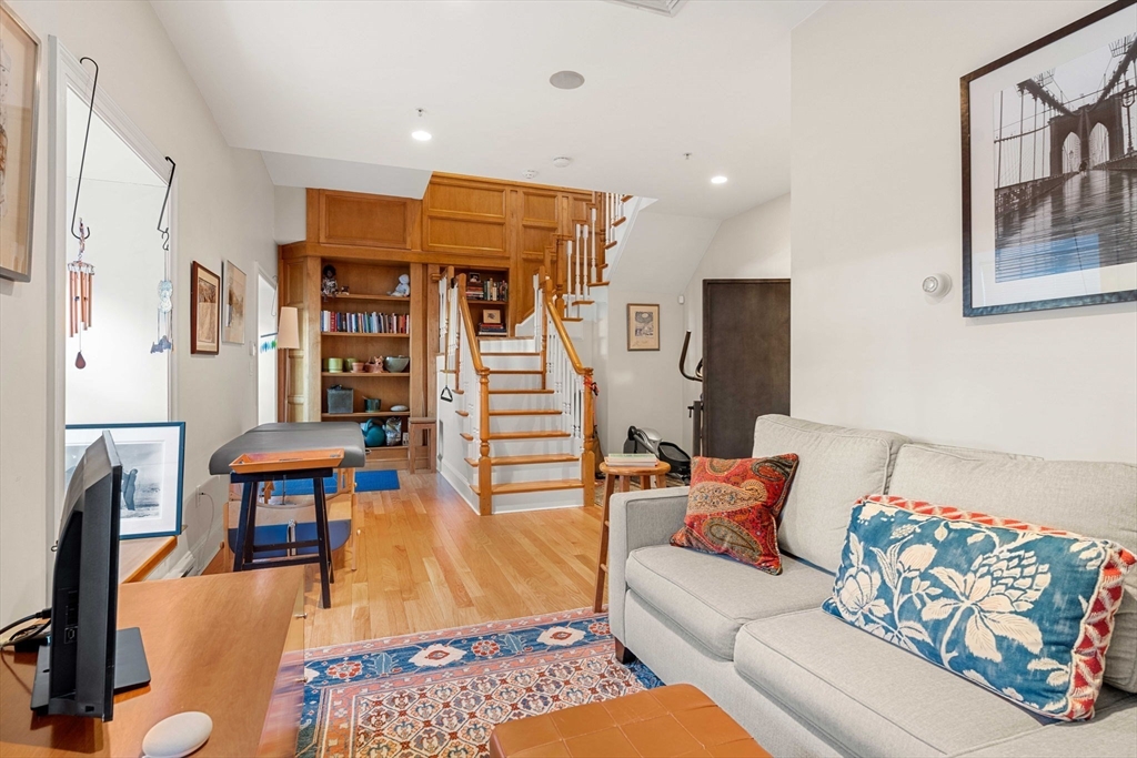 391 Walnut Street, Unit 4 Newton, MA 02460 - Photo 19 of 26 a living room with furniture and wooden floor
