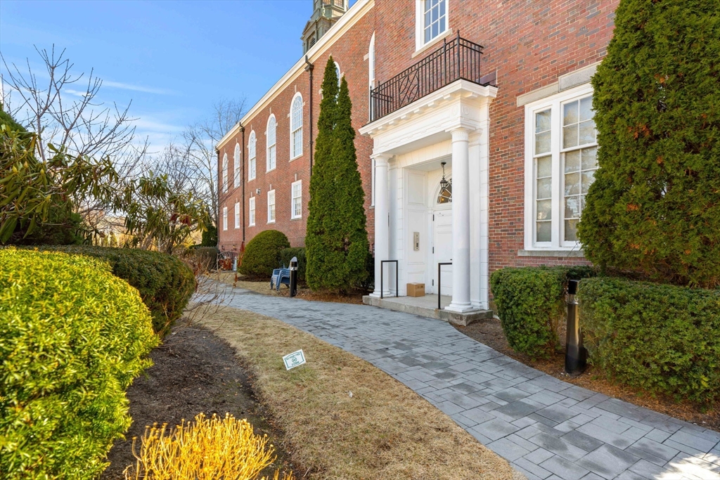 391 Walnut Street, Unit 4 Newton, MA 02460 - Photo 2 of 26 a view of a building with a garden