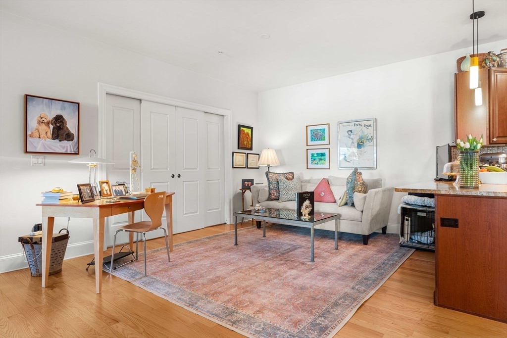 391 Walnut Street, Unit 4 Newton, MA 02460 - Photo 9 of 26 a living room with furniture and wooden floor