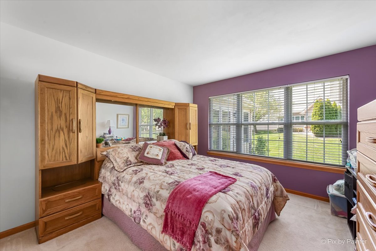 13412 Tall Pines Lane Plainfield, IL 60544 - Photo 13 of 19 a bedroom with a large bed and a large window