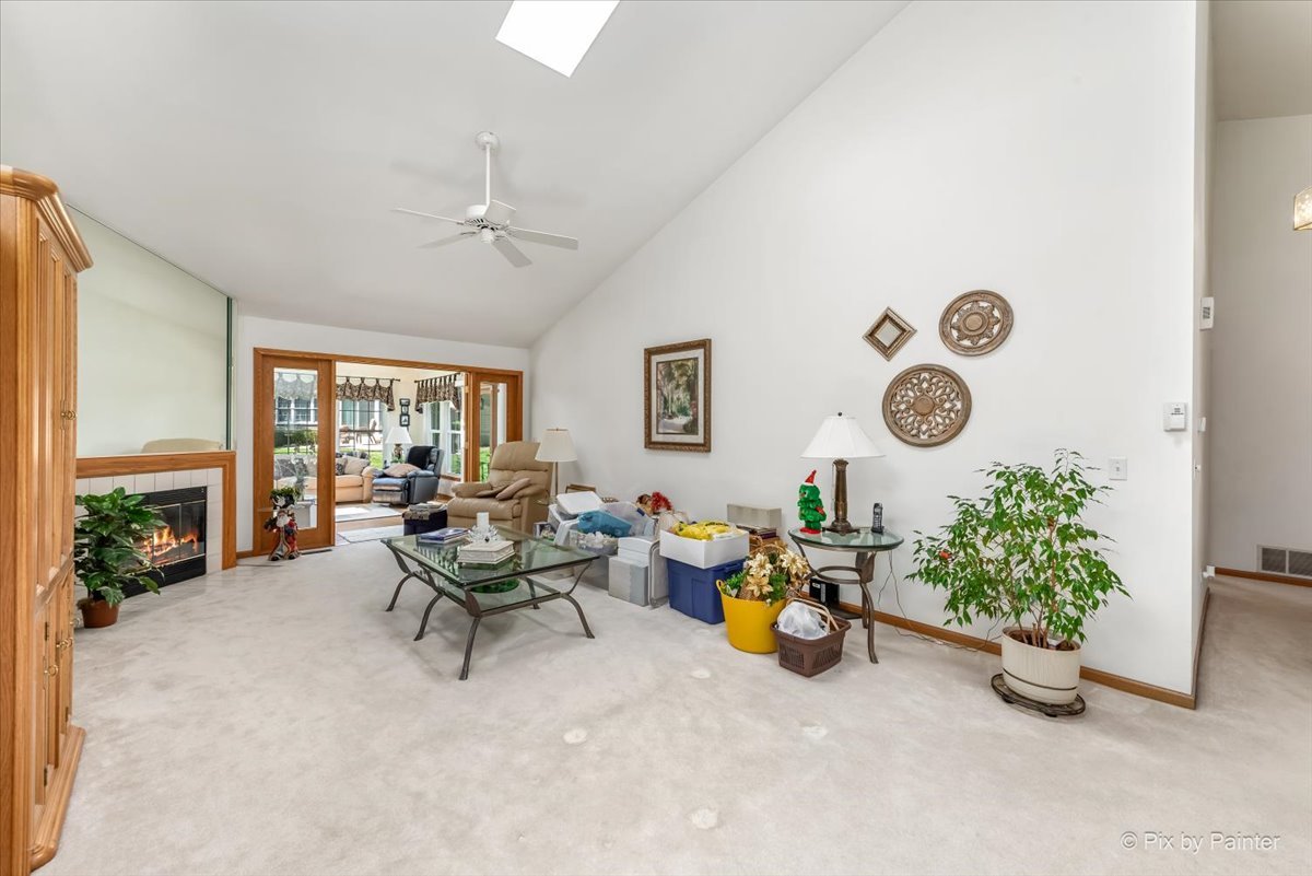 13412 Tall Pines Lane Plainfield, IL 60544 - Photo 4 of 19 a living room with furniture and a fireplace