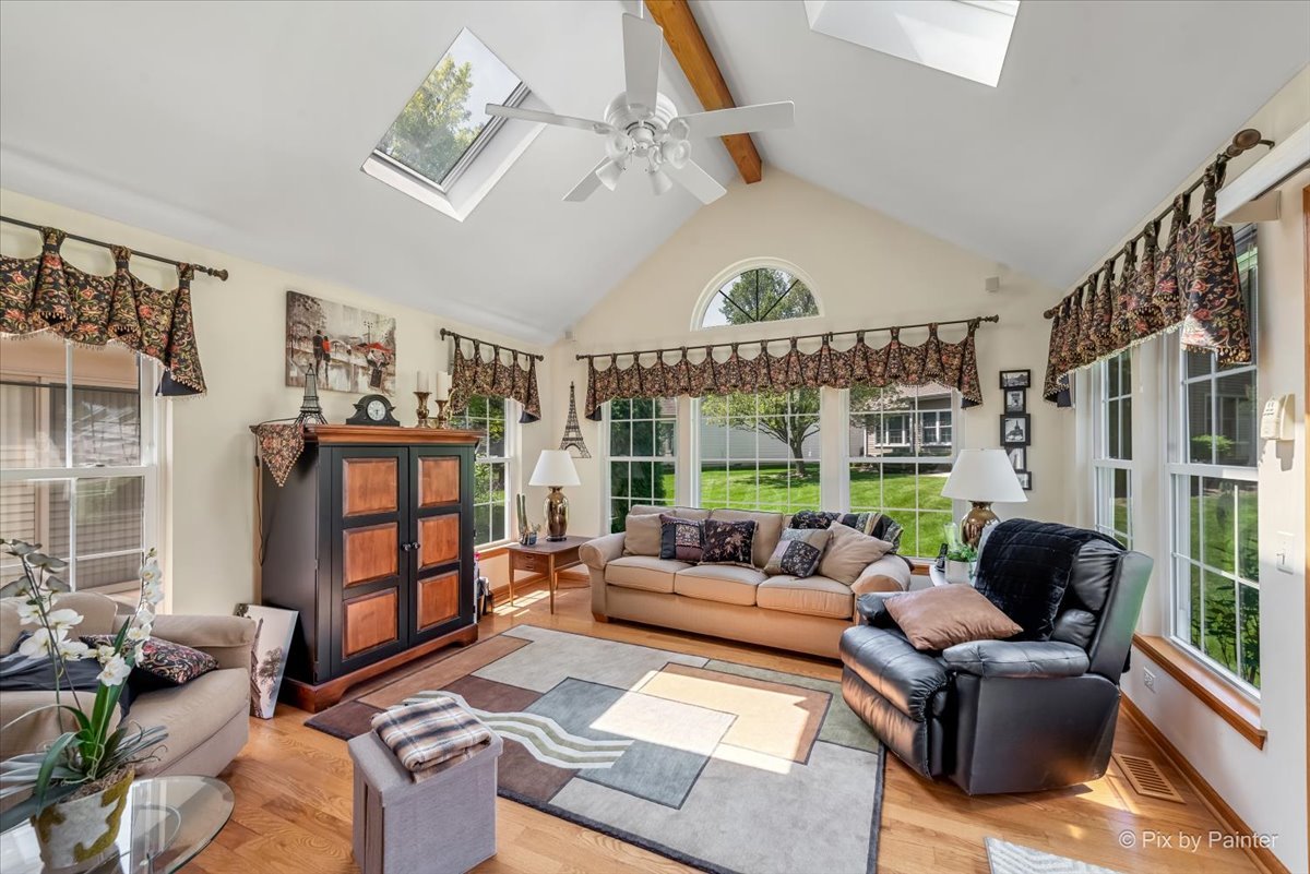 13412 Tall Pines Lane Plainfield, IL 60544 - Photo 7 of 19 a living room with furniture fireplace and a large window