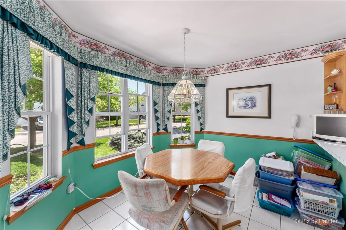 13412 Tall Pines Lane Plainfield, IL 60544 - Photo 10 of 19 a view of a dining room with furniture window and outside view