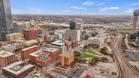 an aerial view of a city with ocean