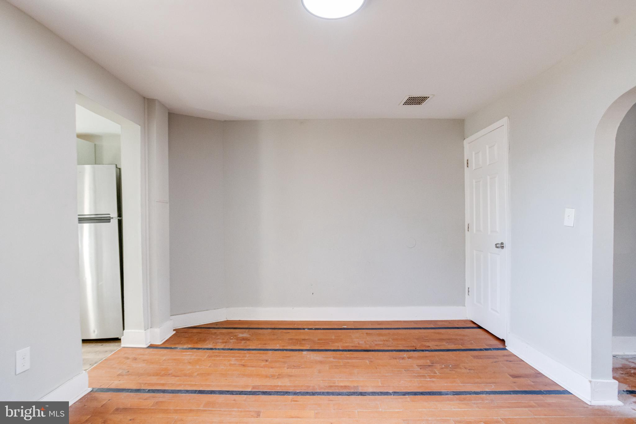 6573 St Helena Avenue Baltimore, MD 21222 - Photo 11 of 37 a bedroom with a bed and a rug