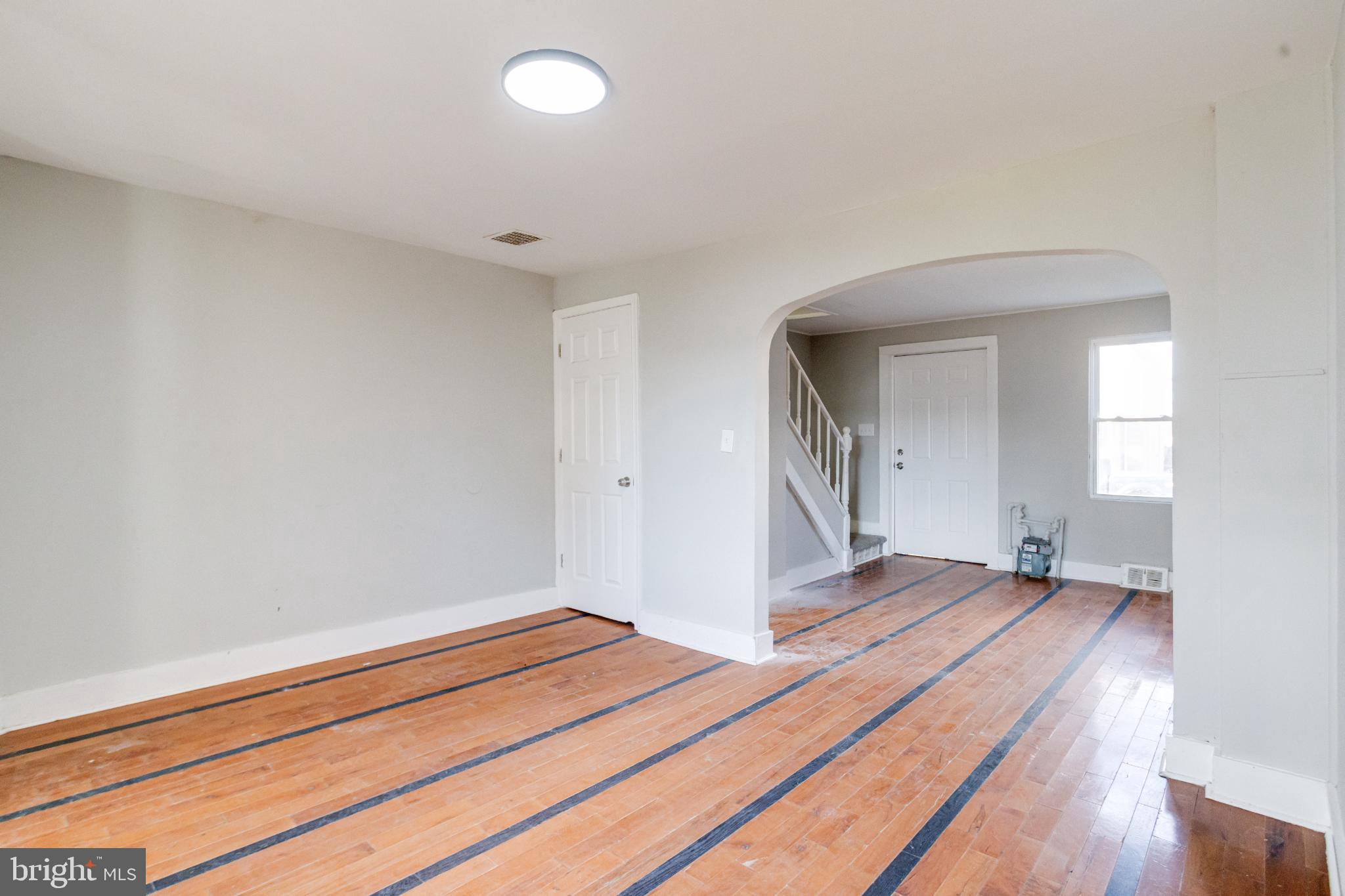 6573 St Helena Avenue Baltimore, MD 21222 - Photo 12 of 37 a view of a room with wooden floor and bathroom