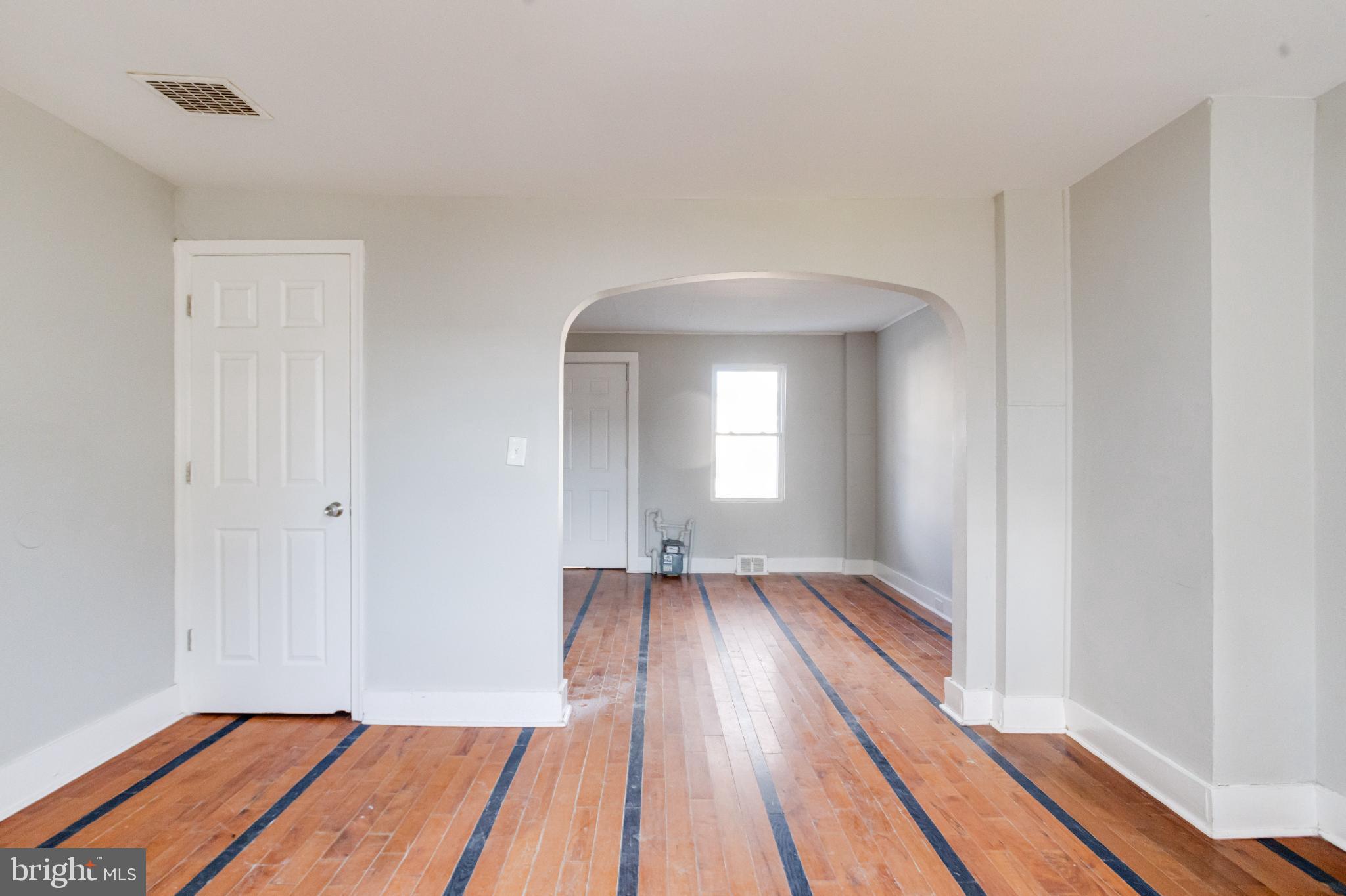 6573 St Helena Avenue Baltimore, MD 21222 - Photo 13 of 37 a view of a room with wooden floor and window
