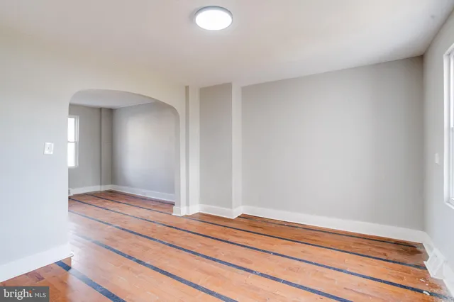 a bedroom with a bed and lamp