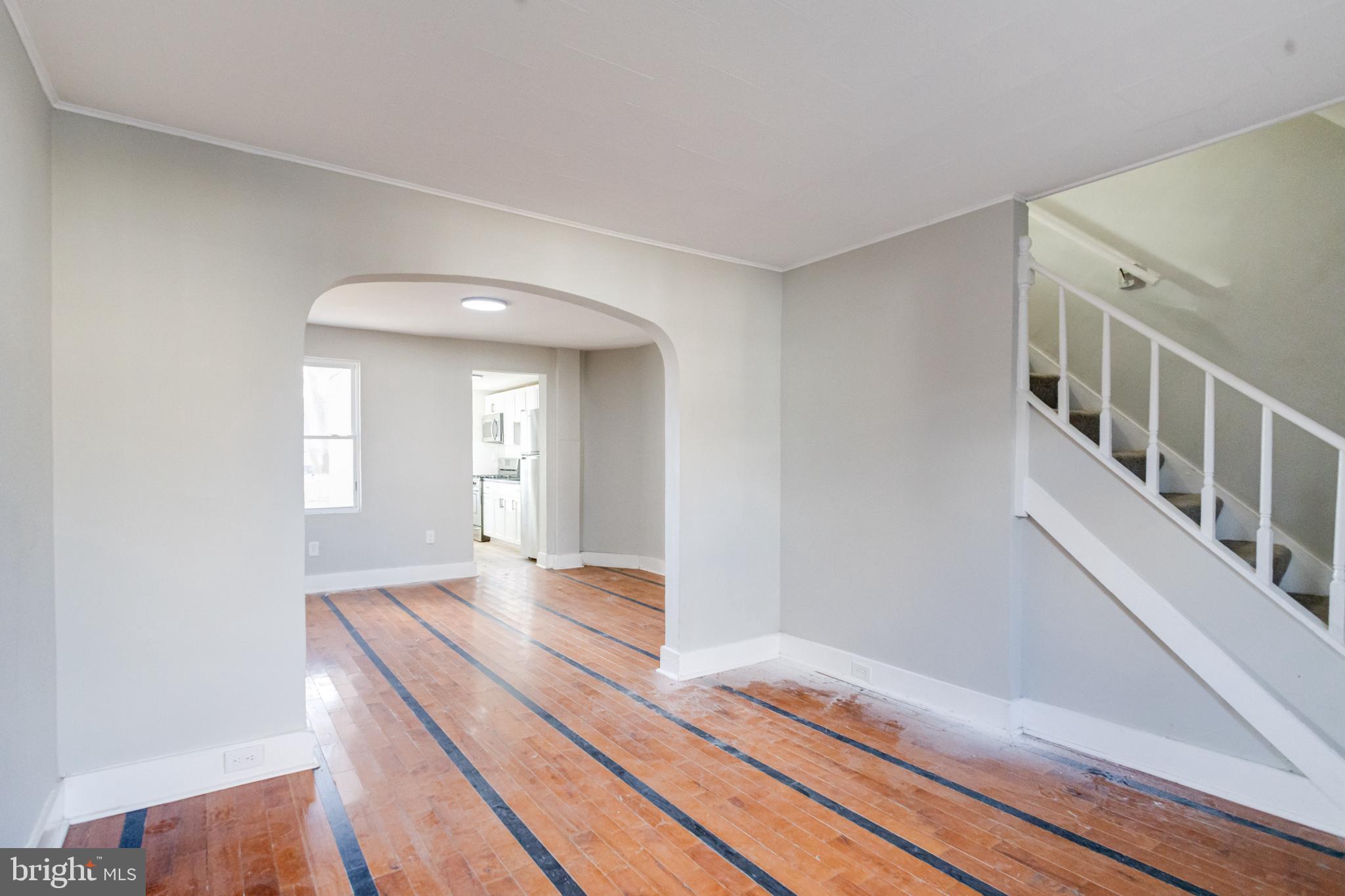 6573 St Helena Avenue Baltimore, MD 21222 - Photo 6 of 37 a bedroom with a bed and wooden floor