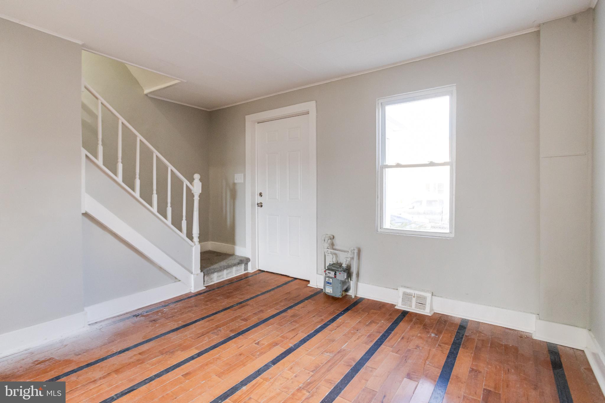 6573 St Helena Avenue Baltimore, MD 21222 - Photo 7 of 37 a bedroom with a bed and a window