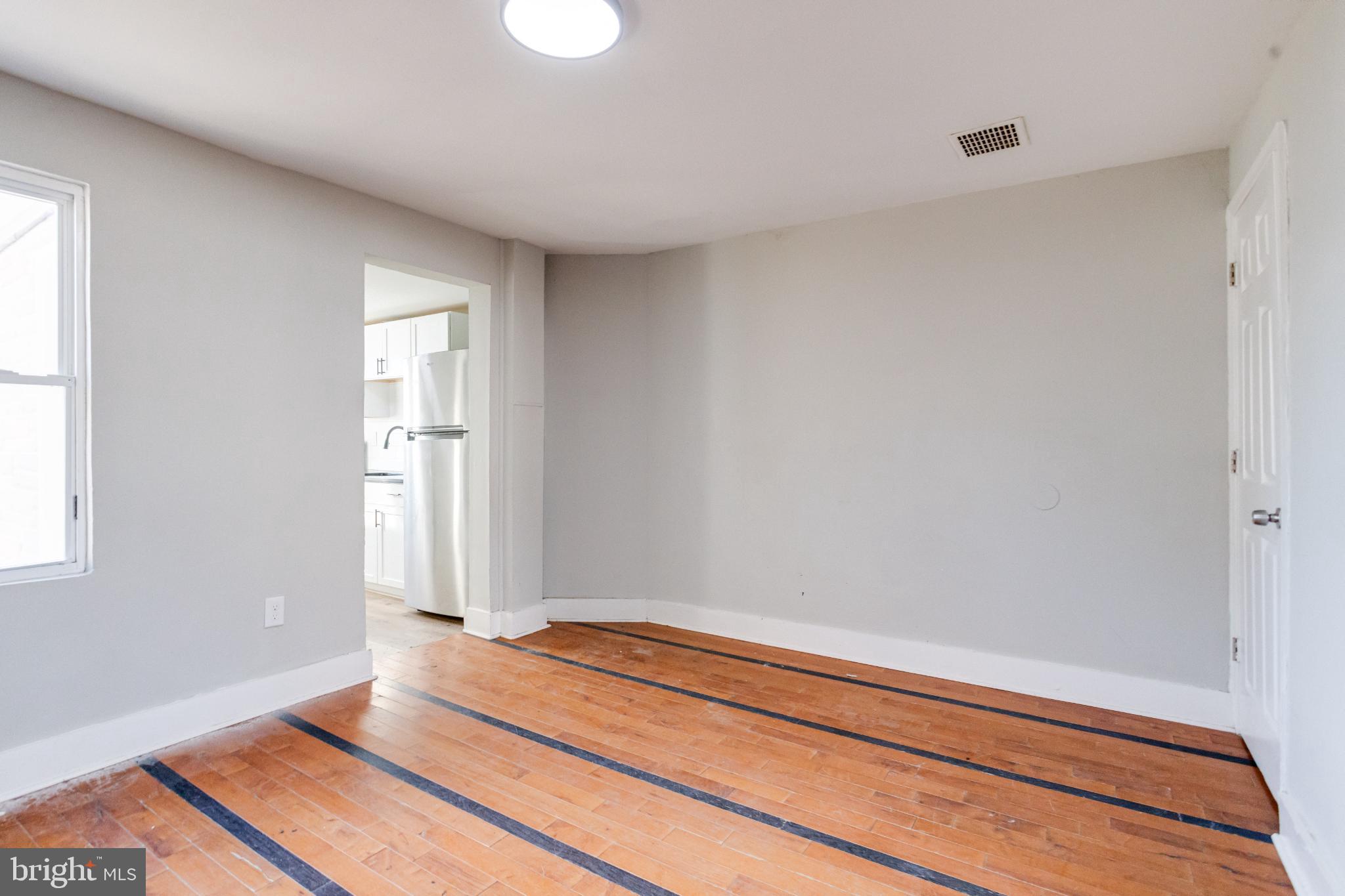 6573 St Helena Avenue Baltimore, MD 21222 - Photo 10 of 37 a bedroom with a bed and a window