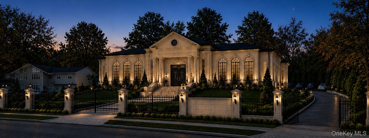 113 Rock Hill Road Spring Valley, NY 10977 - Photo 2 of 14 Stone facade residence featuring a grand entrance, multiple arched windows, and extensive exterior lighting