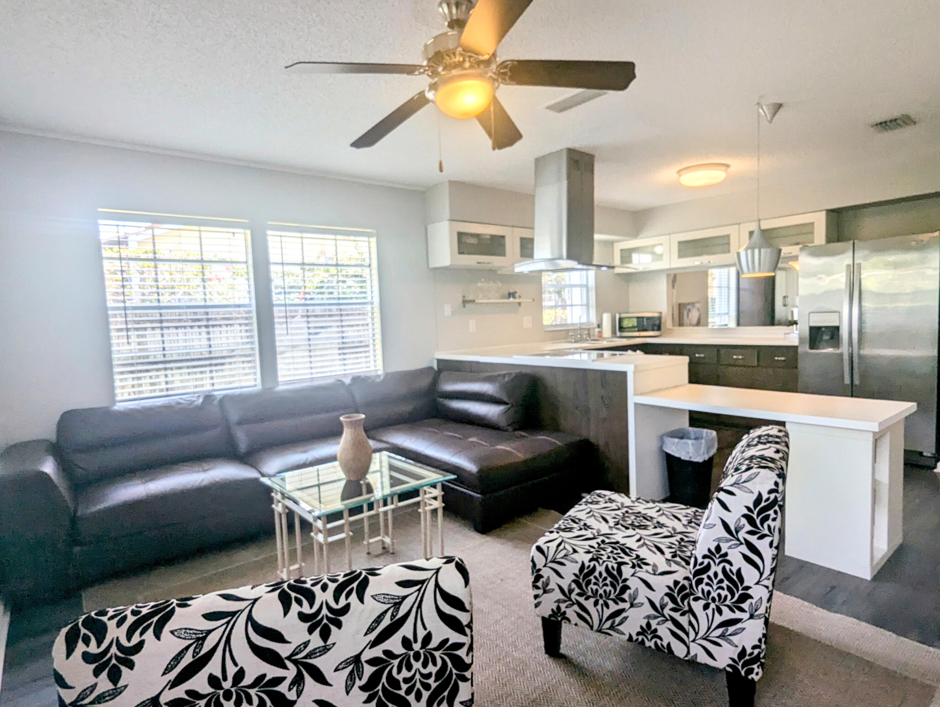 1350 Riverside Circle, Unit S A AND B Wellington, FL 33414 - Photo 21 of 67 a living room with furniture and a large window