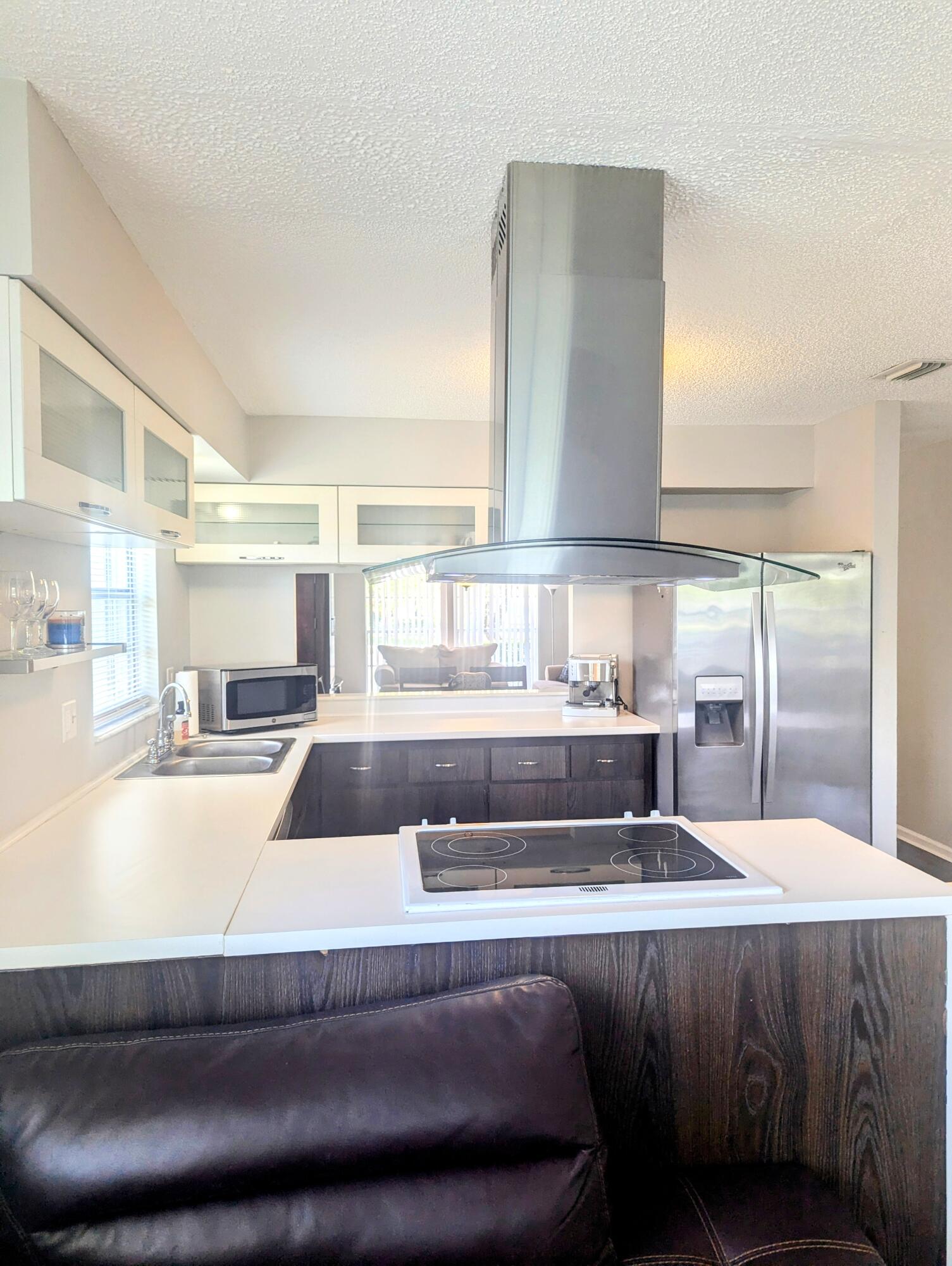 1350 Riverside Circle, Unit S A AND B Wellington, FL 33414 - Photo 23 of 67 a living room with a couch and a coffee table