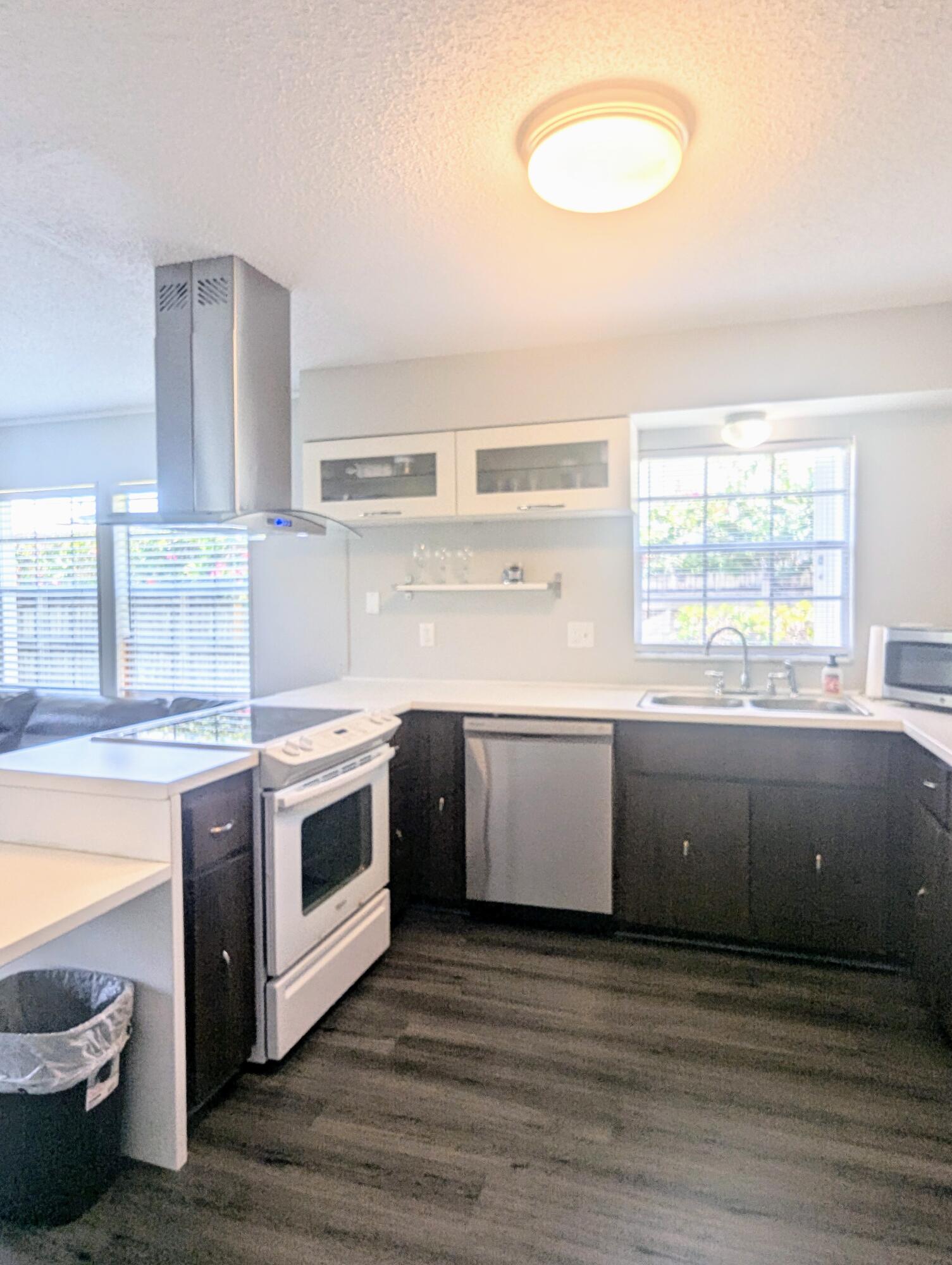 1350 Riverside Circle, Unit S A AND B Wellington, FL 33414 - Photo 24 of 67 a kitchen with a stove a sink and a window