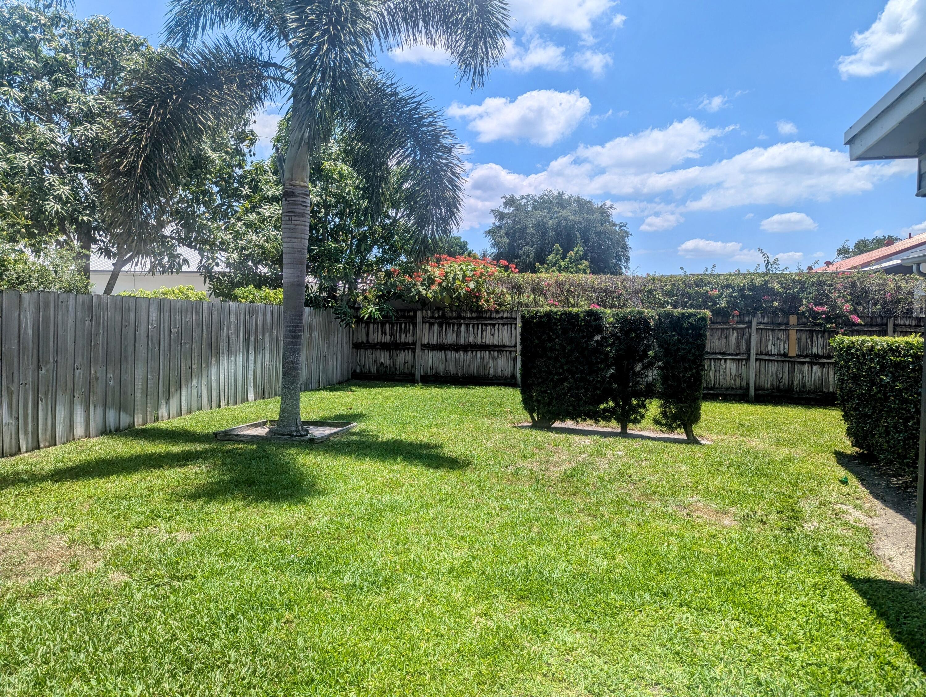 1350 Riverside Circle, Unit S A AND B Wellington, FL 33414 - Photo 31 of 67 a view of a garden with a slide
