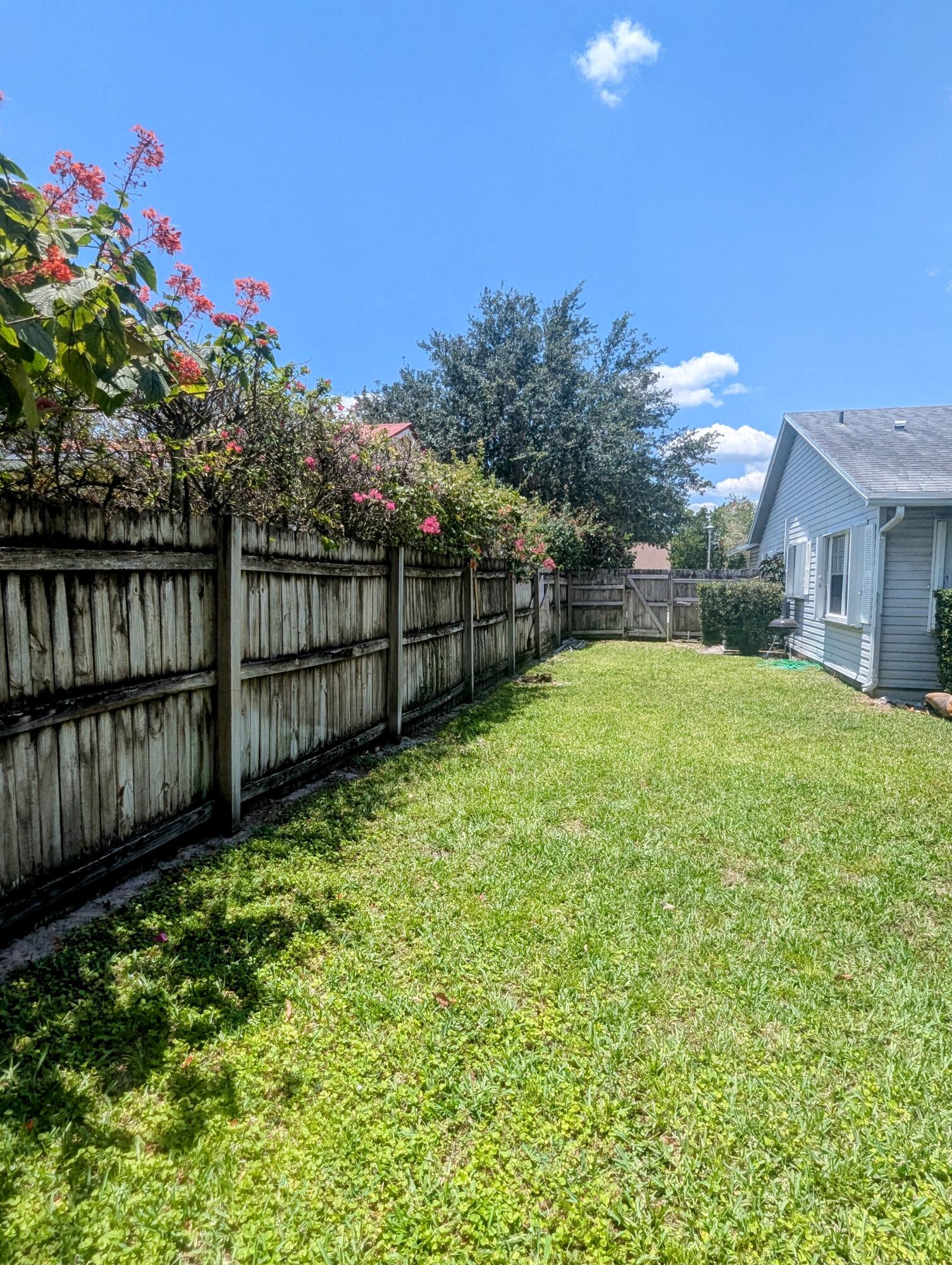 1350 Riverside Circle, Unit S A AND B Wellington, FL 33414 - Photo 34 of 67 a view of a backyard with a garden