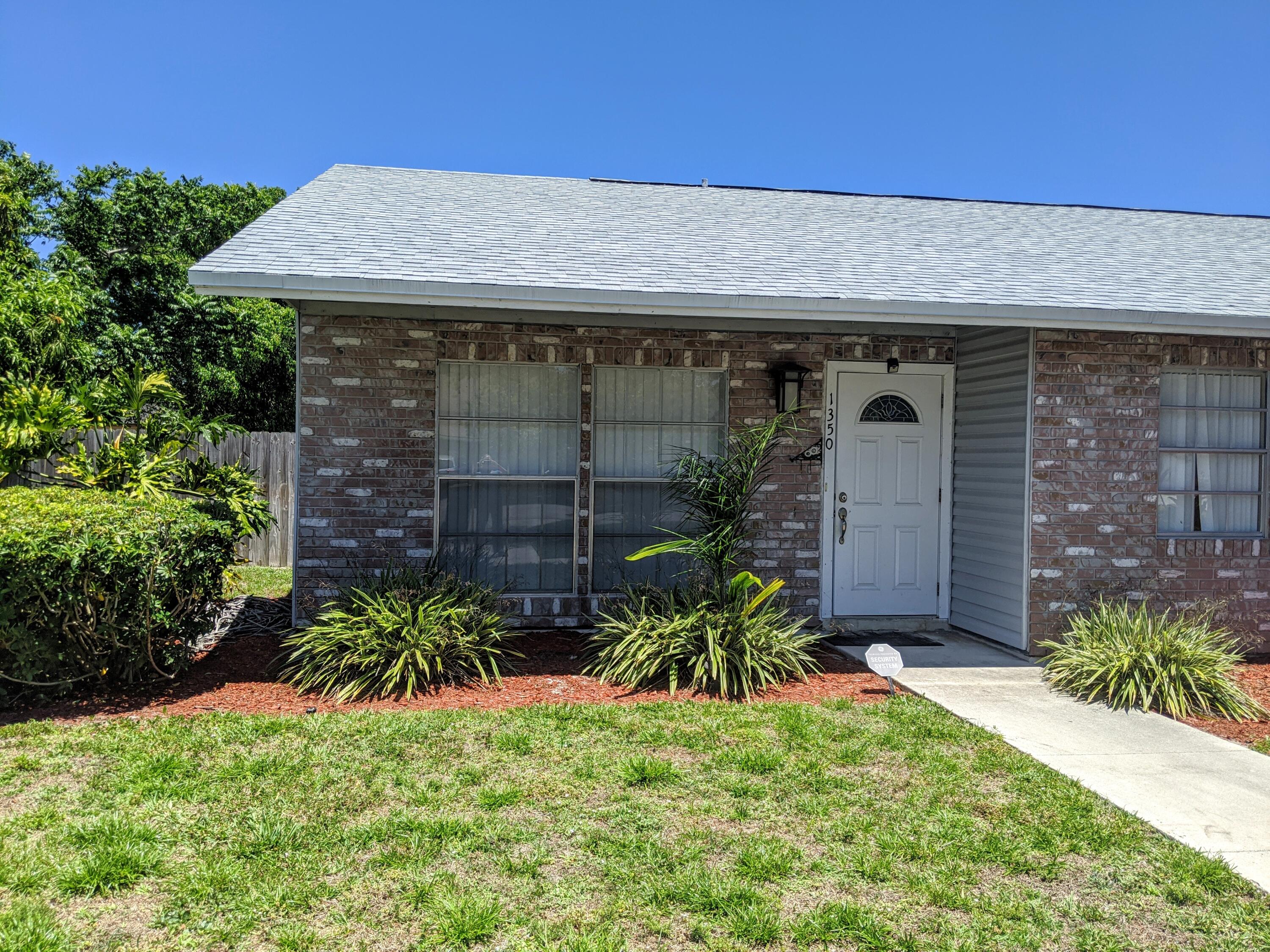 1350 Riverside Circle, Unit S A AND B Wellington, FL 33414 - Photo 38 of 67 a view of a backyard with plants