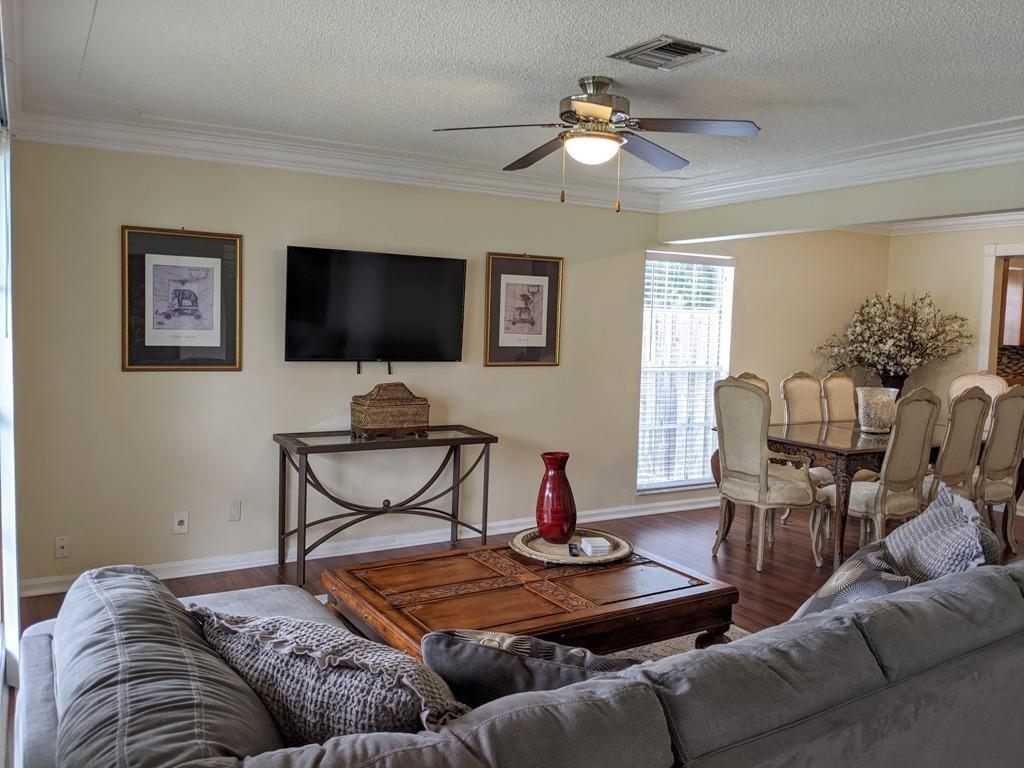 1350 Riverside Circle, Unit S A AND B Wellington, FL 33414 - Photo 39 of 67 a living room with furniture and a flat screen tv