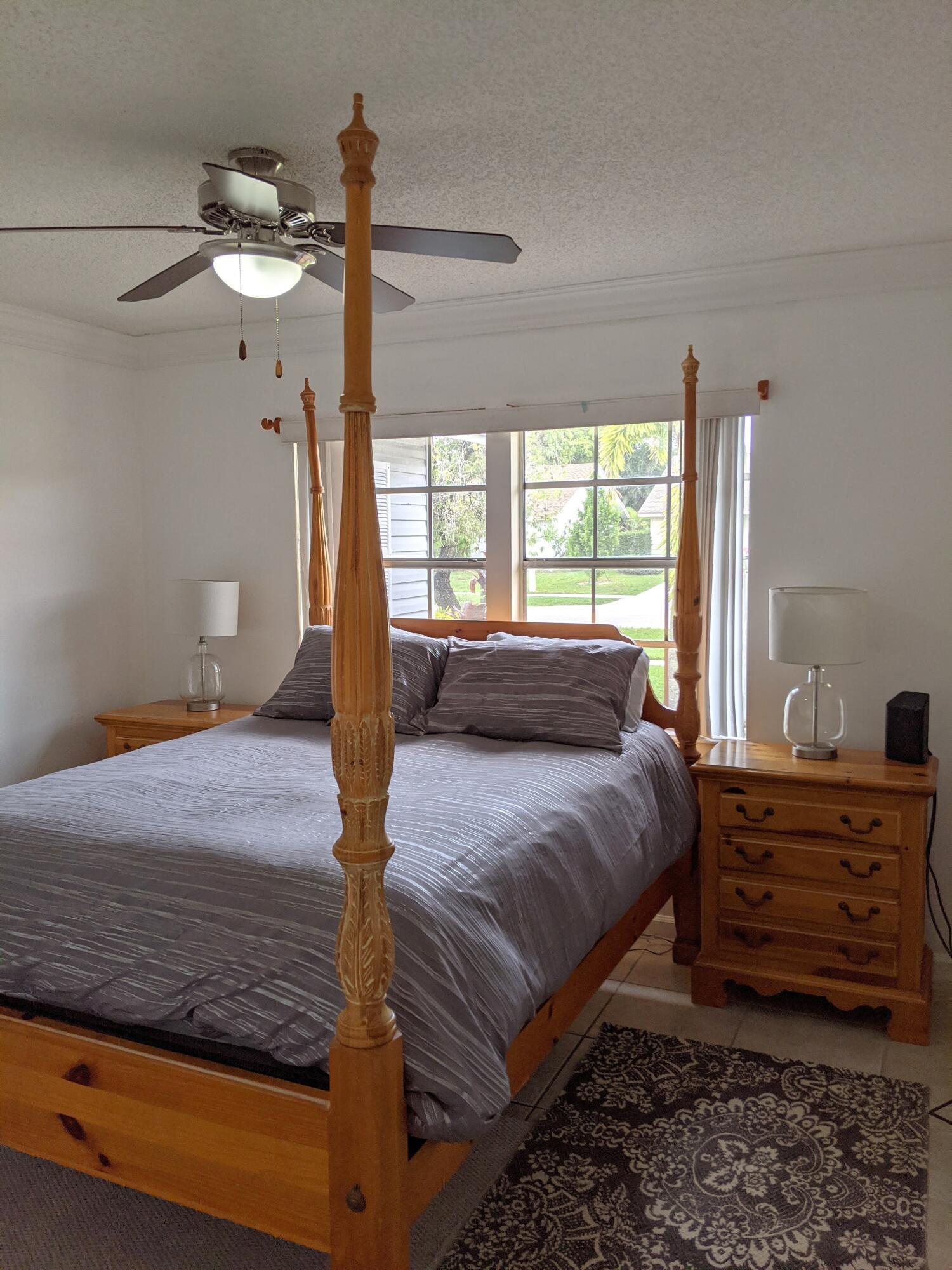 1350 Riverside Circle, Unit S A AND B Wellington, FL 33414 - Photo 57 of 67 a bedroom with a bed dresser and a window