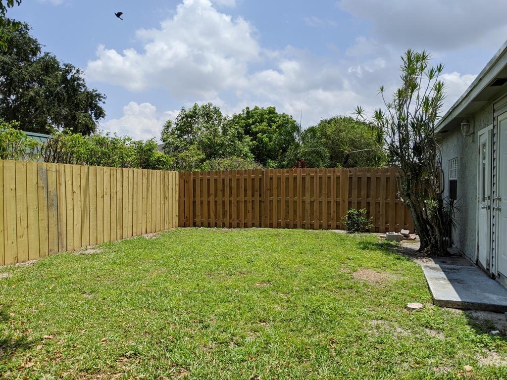 1350 Riverside Circle, Unit S A AND B Wellington, FL 33414 - Photo 64 of 67 a view of a backyard with of the house