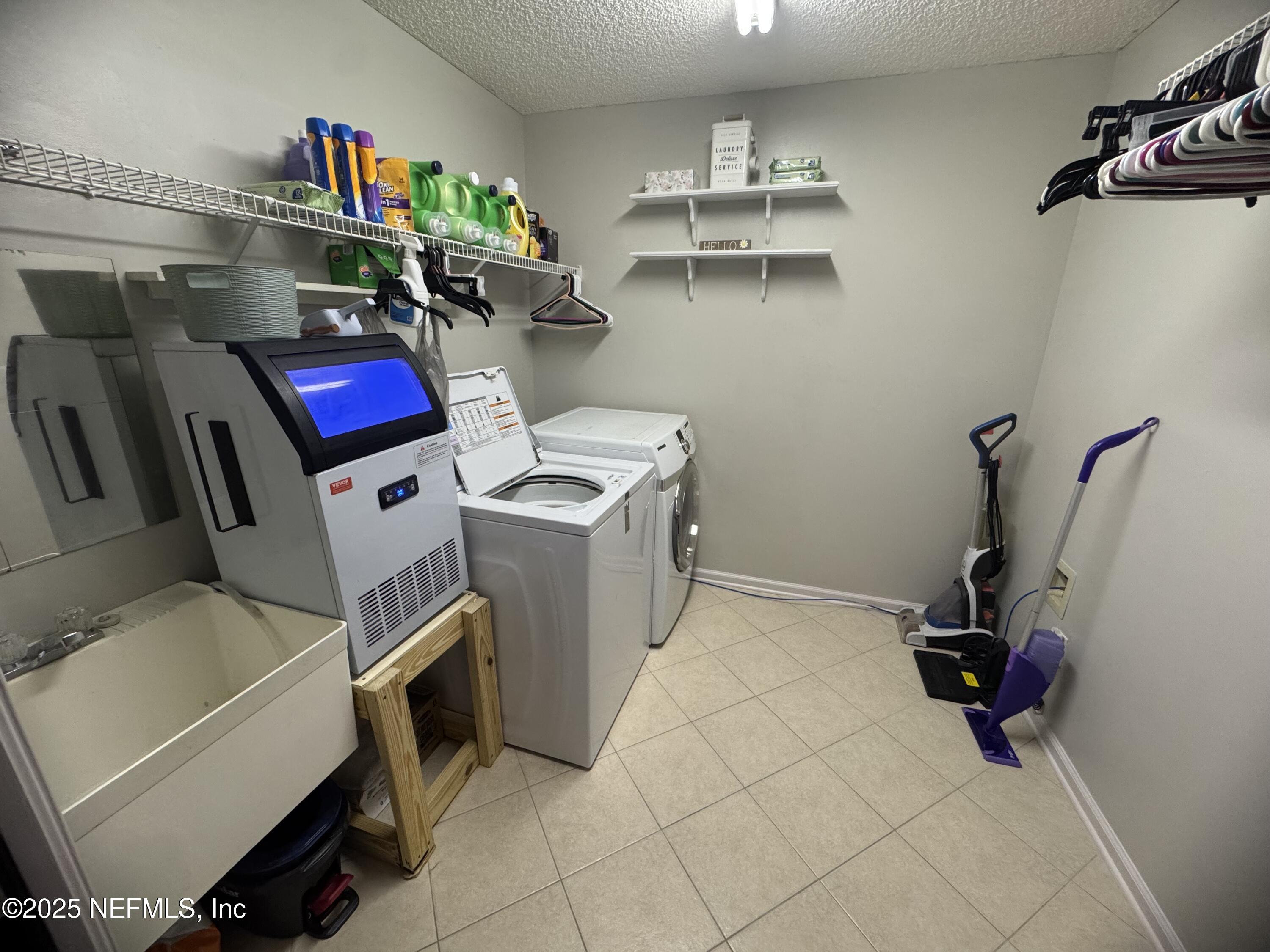 627 Whitfield Road Jacksonville, FL 32221 - Photo 14 of 18 a utility room with dryer and washer