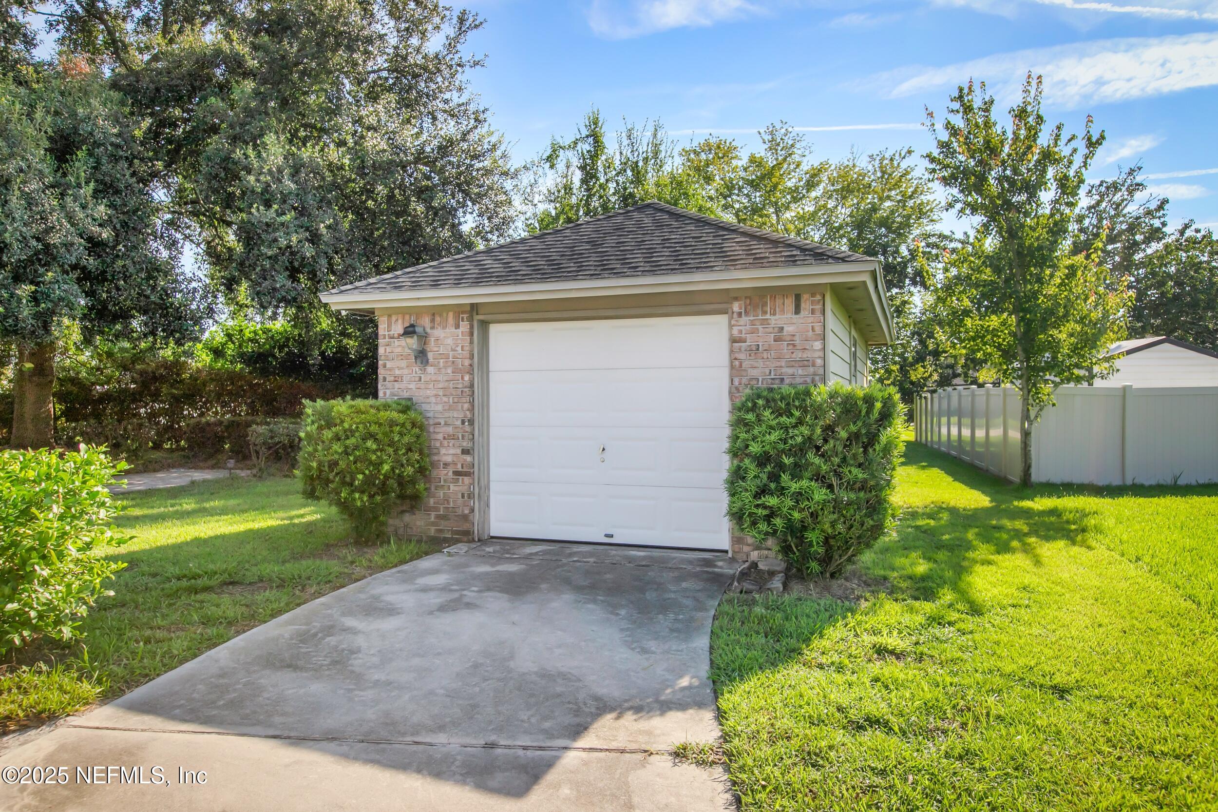 627 Whitfield Road Jacksonville, FL 32221 - Photo 16 of 18 a front view of a house with garden