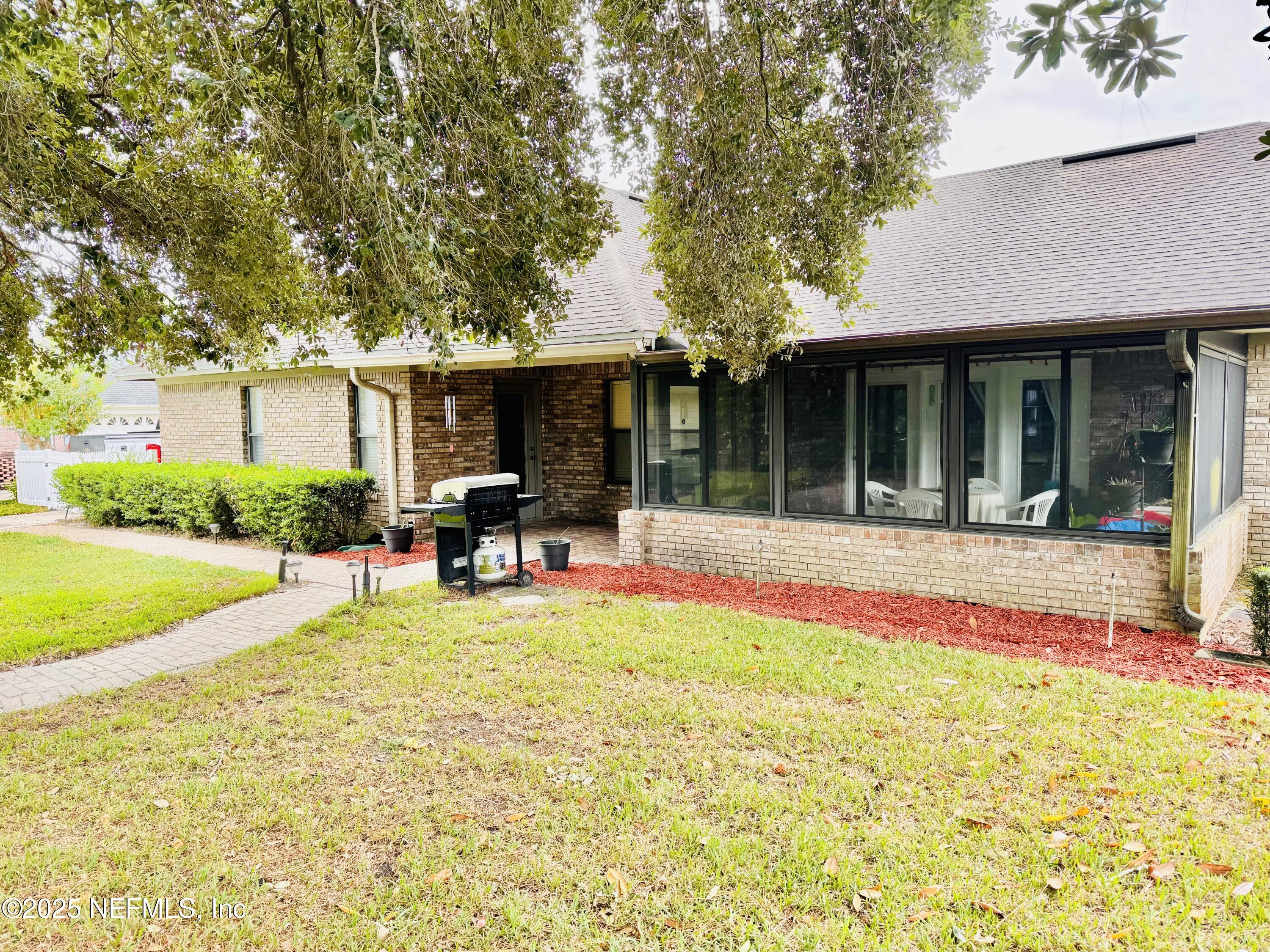 627 Whitfield Road Jacksonville, FL 32221 - Photo 17 of 18 a view of house with swimming pool and porch with furniture