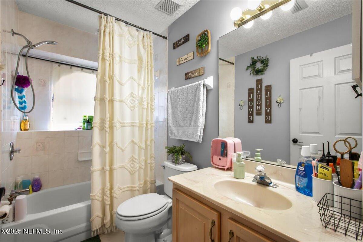 627 Whitfield Road Jacksonville, FL 32221 - Photo 10 of 18 a bathroom with a sink toilet and shower